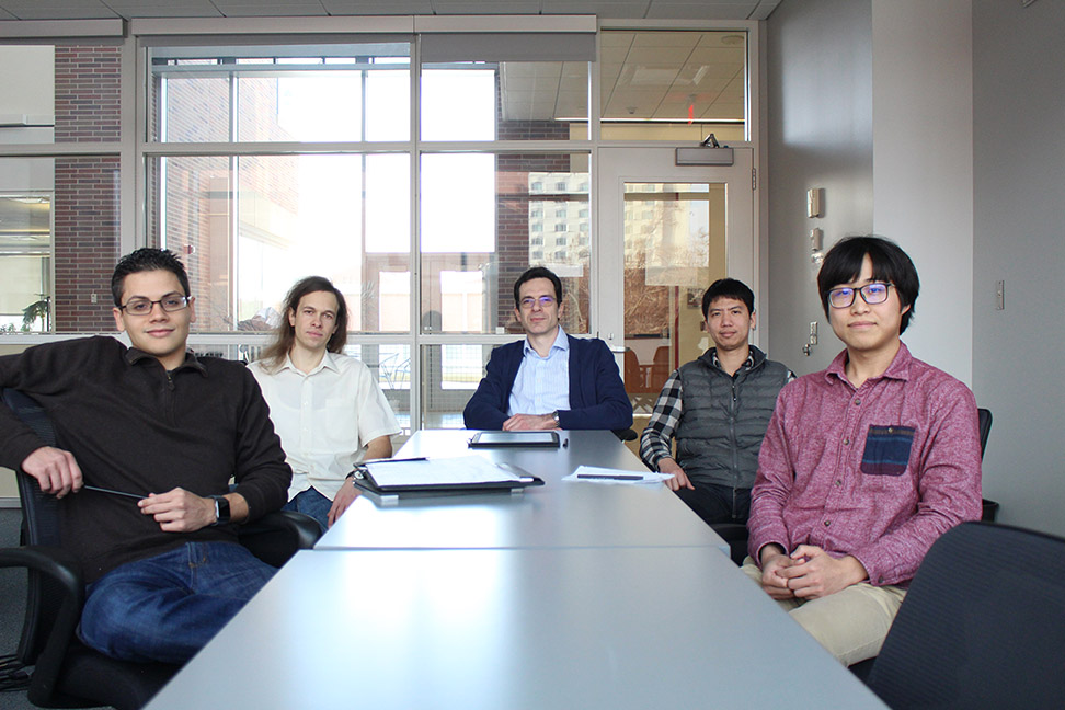 Giovanni Baez Flores, Ivan Zhuravlev, Kirill Belashchenko, Po-Hao Chang, and Wuzhang Fang are pictured sitting around a table